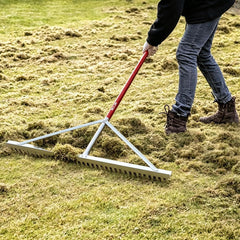 KYLIN assembled full-length rake leaned against fence showing scale and reach