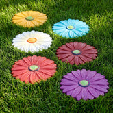Landical front view of six daisy stepping stones showing vibrant colors and garden-ready design