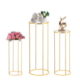 Latywen front view of three gold cylinder pedestal stands, elevates decor