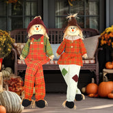 Libima front view of two sitting scarecrows creating warm fall curb appeal