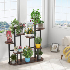 LITTLE TREE plant stand filled with pots in a living room adding vertical greenery