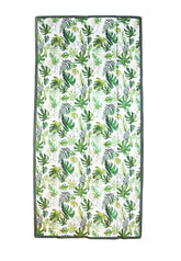 Little Unicorn front packaged blanket showing tropical leaf pattern and compact fold benefit
