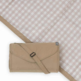 Little Unicorn blanket front view shows beige buffalo check and durable outdoor use