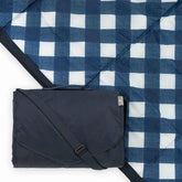 Little Unicorn navy plaid blanket front view shows roomy surface and classic pattern benefit