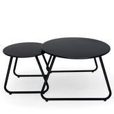 Meluvici front view showing two black round tables and compact outdoor style