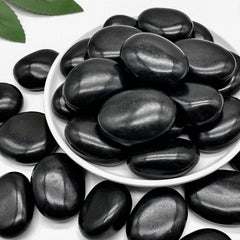Mengdewei front of bag showing polished black river rocks and product weight