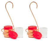 Monarch Abode front view of two copper feeders showing elegant outdoor décor and durability