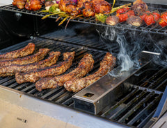 Monument Grills smoker box filled with wood chips ready to add rich smoky flavor