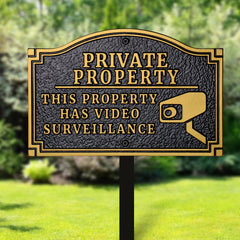 Morgtta sign attached to fence showing neat installation and deterrent