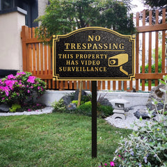Morgtta sign installed on yard stake showing visible deterrent benefit