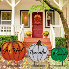 MorningRo front view of three pumpkin stakes adding curb appeal