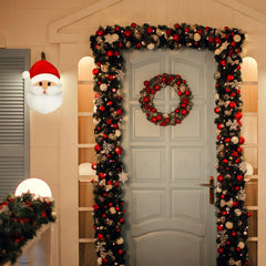 Mudder Santa cover installed on porch light demonstrating weatherproof protection