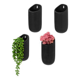 MyGift front view of four matte black wall planters showing modern style and compact display