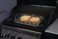 Napoleon basket on grill with fish fillets demonstrating gentle cooking without sticking