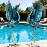 Natelf front view of blue heron statues showing elegant yard focal point