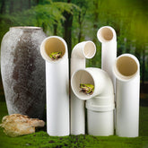 Nuanchu front view of five white PVC frog houses showing compact design and outdoor appeal