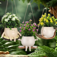 Nuogo front view three-pack hanging face planters shows playful decor
