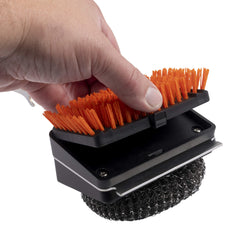 Oklahoma Joe's detailed steel wool head removing baked-on residue from hot grates