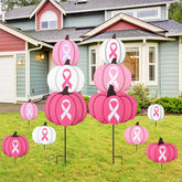 Otoolling front view of two metal pumpkin yard signs showing bright awareness colors