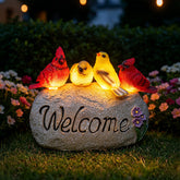 Ovewios front view of welcome stone showing colorful birds and greeting