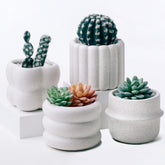 Parlamain front view of four ceramic planters showing modern terrazzo design and cohesive set