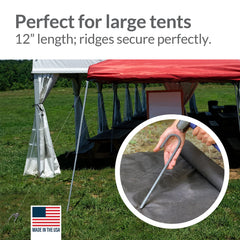 Pinnacle Mercantile stakes driven into tarp corners securing cover from wind