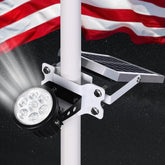 PPQ flag pole light front view showing compact weatherproof housing and even beam