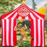 Preboun front view of circus archway showing bold red white colors and instant welcome