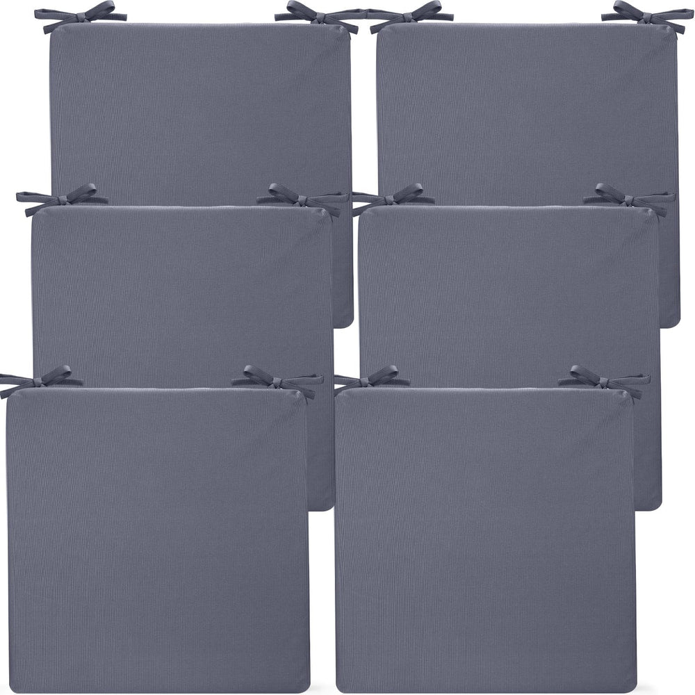 Preboun front view of six dark gray cushions showing neat stack and uniform look