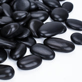 Pulovin bag front packaging showing 30 lb black river rocks and clear labeling benefit