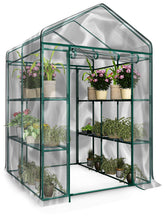 Pure Garden front view showing greenhouse with clear PVC cover and door, protecting plants
