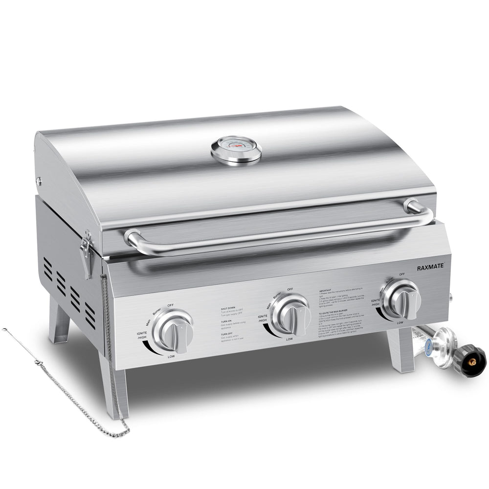 Raxmate front view of grill showing compact stainless steel housing and carrying handle for portability