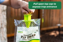 RESCUE! trap hung beside a garbage can catching flies, protects patio and trash areas