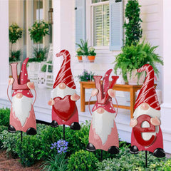 Ridota front view of four gnome stakes spelling LOVE, bright garden pop