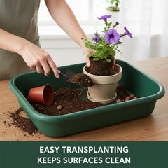 RooTrimmer tray on potting bench with plants and tools for efficient repotting