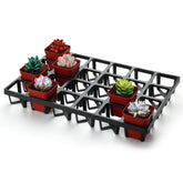 RooTrimmer front view showing 24-cell tray and organized pots for quick transport