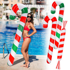 Rotatingpals yard display with candy canes staging an outdoor holiday-in-July decoration