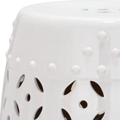 SAFAVIEH stool beside sofa showing scale and multiuse function as side table or extra seat