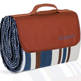 scuddles front view showing blanket folded and travel-ready with strap for portability