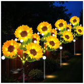 Seilvda front view showing four sunflower stakes illuminating a garden path