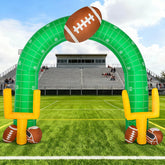 Shappy front view of giant football arch creating game-day entrance
