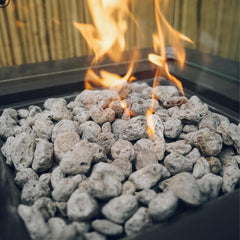 Skyflame lava rocks in a firepit producing even, visible flames and ambiance