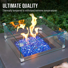 Skyflame in firepit night view with flames above glass creating vibrant blue highlights
