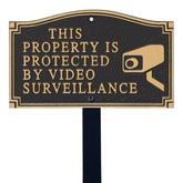 SmartSign front view of black and gold plaque showing clear surveillance message