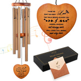 Soopau front view showing golden wind chime in black gift box, comforting presentation