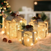 SPRKLINLIN front view of three lighted gift boxes showing warm glow and festive appeal
