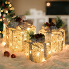 SPRKLINLIN front view of three lighted gift boxes showing warm glow and festive appeal