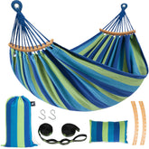 SUNCREAT double hammock front view showing full blue and green bed and spreader bars for relaxed lounging