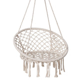 SUNCREAT front view of beige hammock chair showing inviting seat and tassels