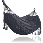 SUNCREAT front view of dark gray two-person hammock showing full bed and tassels for comfortable lounging